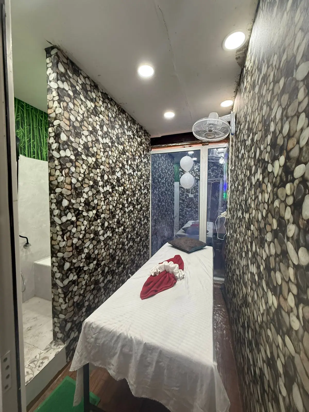 Treatment room lit for an evening session at Six Sense Spa